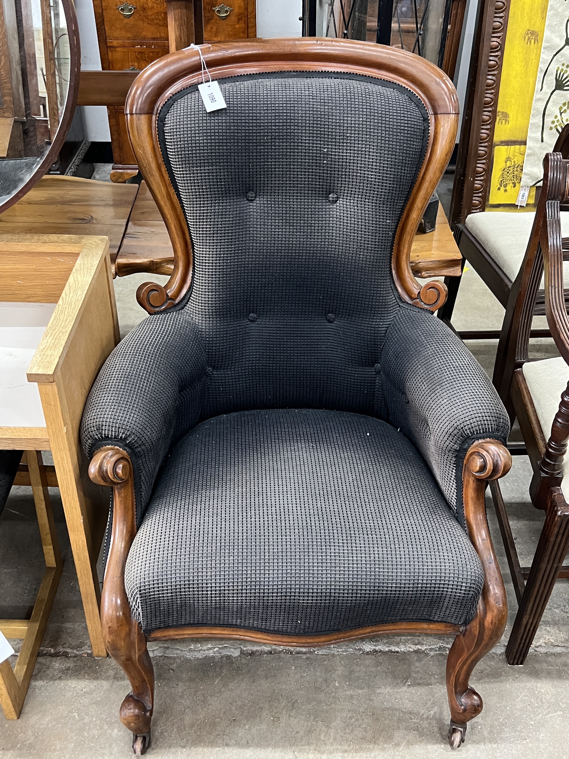 A Victorian mahogany spoonback armchair, width 72cm, depth 62cm, height 104cm